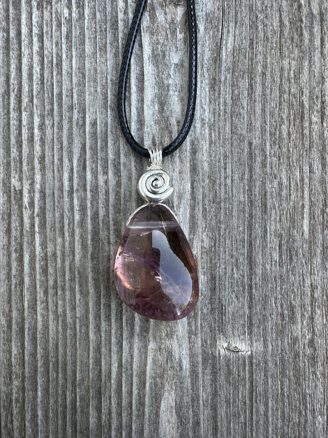 Ametrine for Connecting Physical and Metaphysical Realms, Clarity, and Harmony. Swirl to Signify Consciousness.