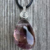 Ametrine for Connecting Physical and Metaphysical Realms, Clarity, and Harmony. Swirl to Signify Consciousness.