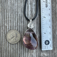 Ametrine for Connecting Physical and Metaphysical Realms, Clarity, and Harmony. Swirl to Signify Consciousness.