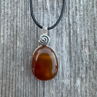 Carnelian for Courage, Success and Creativity. Swirl to Signify Consciousness.