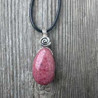 Rhodonite for Compassion, Balancing Emotions, and Self Confidence. Swirl to Signify Consciousness.