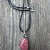 Rhodonite for Compassion, Balancing Emotions, and Self Confidence. Swirl to Signify Consciousness.