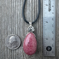 Rhodonite for Compassion, Balancing Emotions, and Self Confidence. Swirl to Signify Consciousness.