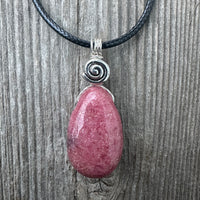 Rhodonite for Compassion, Balancing Emotions, and Self Confidence. Swirl to Signify Consciousness.