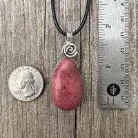 Rhodonite for Compassion, Balancing Emotions, and Self Confidence. Swirl to Signify Consciousness.