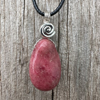 Rhodonite for Compassion, Balancing Emotions, and Self Confidence. Swirl to Signify Consciousness.
