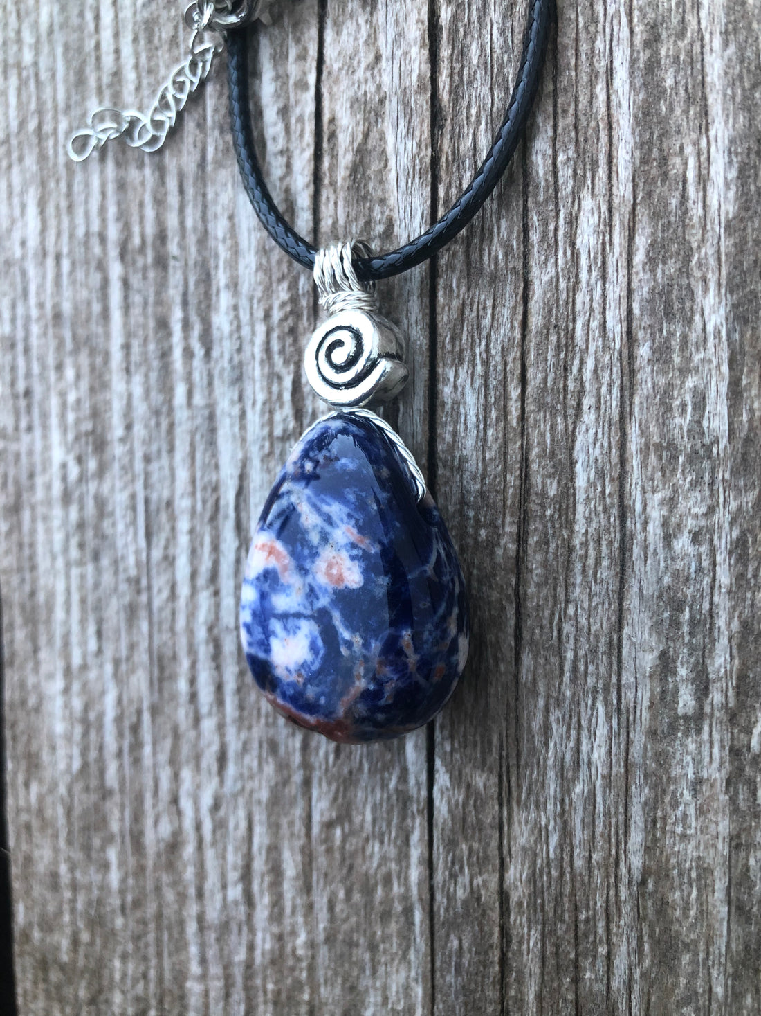 Sodalite for Creativity and Inspiration. Swirl to Signify Consciousness.