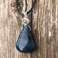 Sieber Agate for Strength, Confidence and Protection. Swirl to Signify Consciousness.