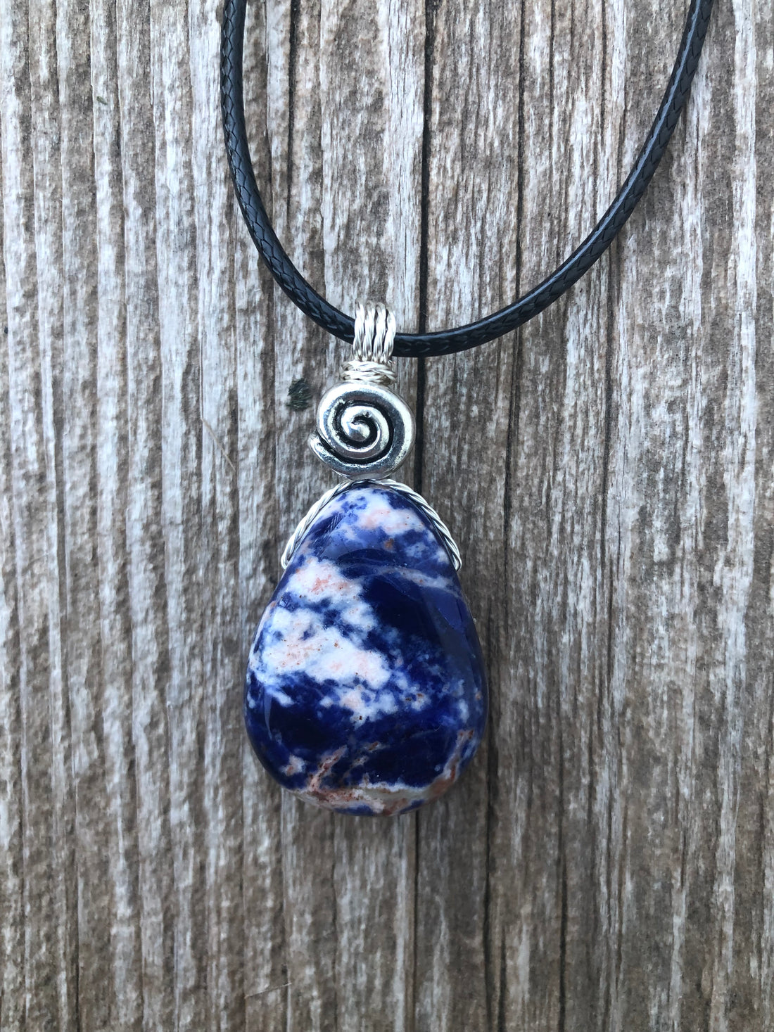 Sodalite for Creativity and Inspiration. Swirl to Signify Consciousness.