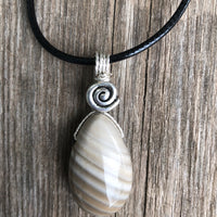 Flint for Grounding and Past Life Work. Swirl to Signify Consciousness.