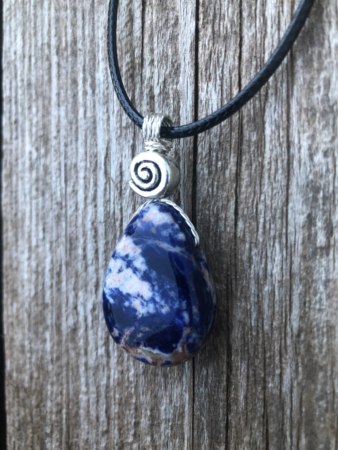 Sodalite for Creativity and Inspiration. Swirl to Signify Consciousness.