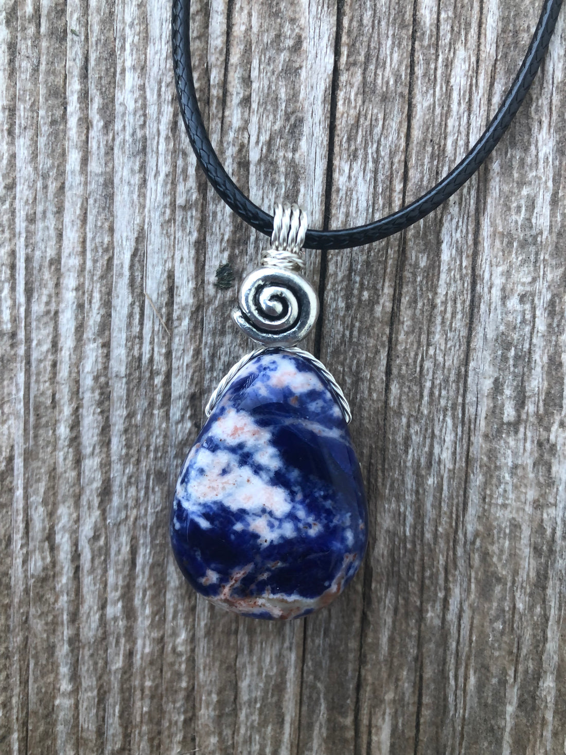 Sodalite for Creativity and Inspiration. Swirl to Signify Consciousness.