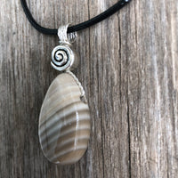 Flint for Grounding and Past Life Work. Swirl to Signify Consciousness.