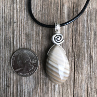 Flint for Grounding and Past Life Work. Swirl to Signify Consciousness.