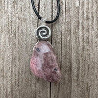 Rhodonite for Compassion, Balancing Emotions, and Self Confidence. Swirl to Signify Consciousness.
