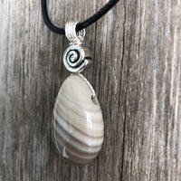 Flint for Grounding and Past Life Work. Swirl to Signify Consciousness.