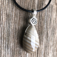 Flint for Grounding and Past Life Work. Swirl to Signify Consciousness.