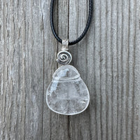 Rock Crystal for Wisdom, Loyalty and Protection. Swirl to Signify Consciousness.