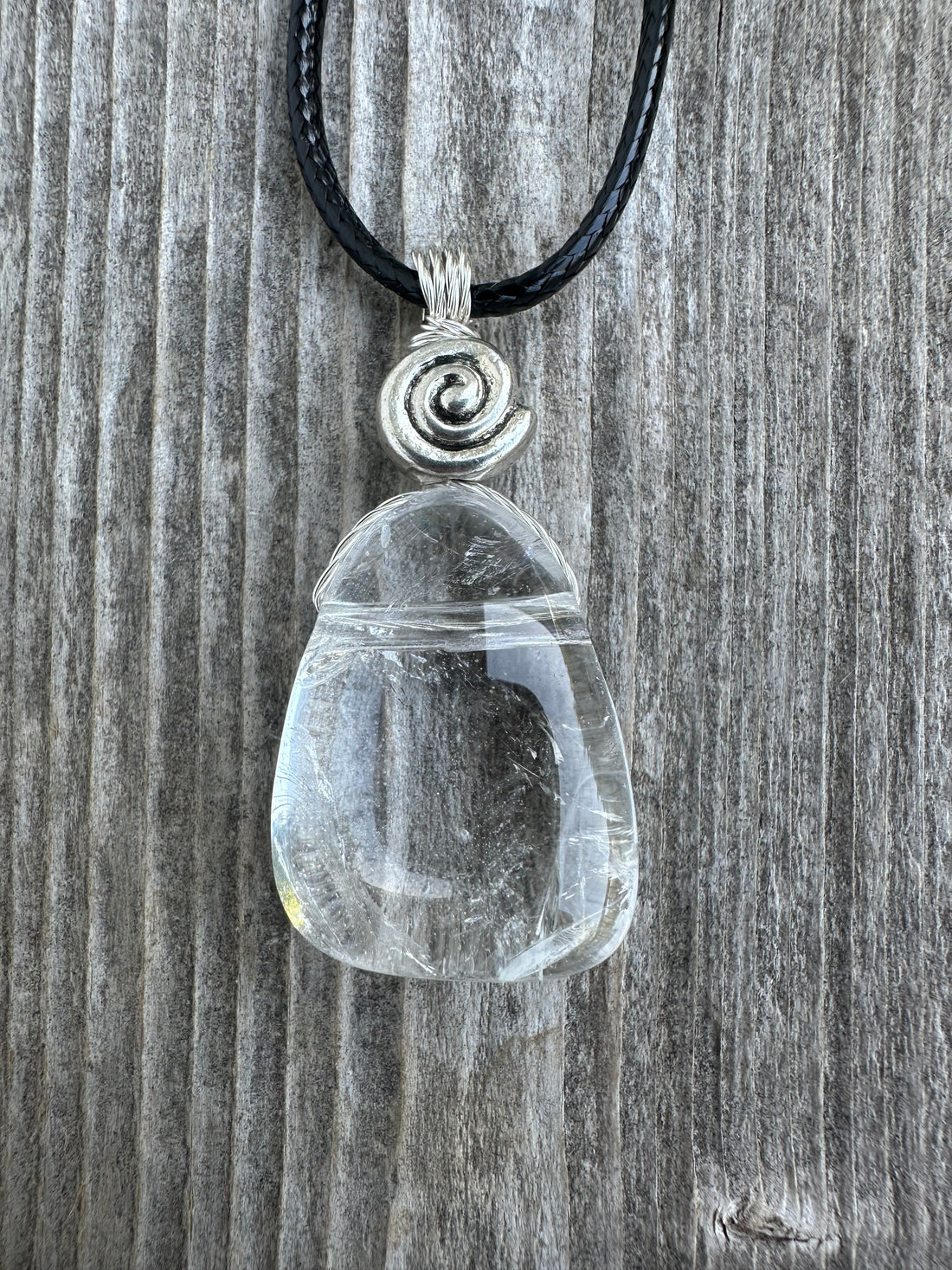 Rock Crystal for Wisdom, Loyalty and Protection. Swirl to Signify Consciousness.