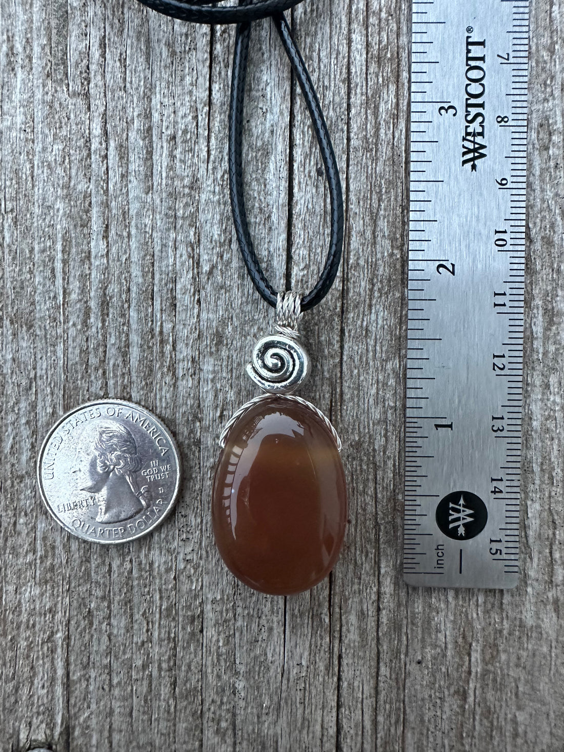 Carnelian for Courage, Success and Creativity. Swirl to Signify Consciousness.