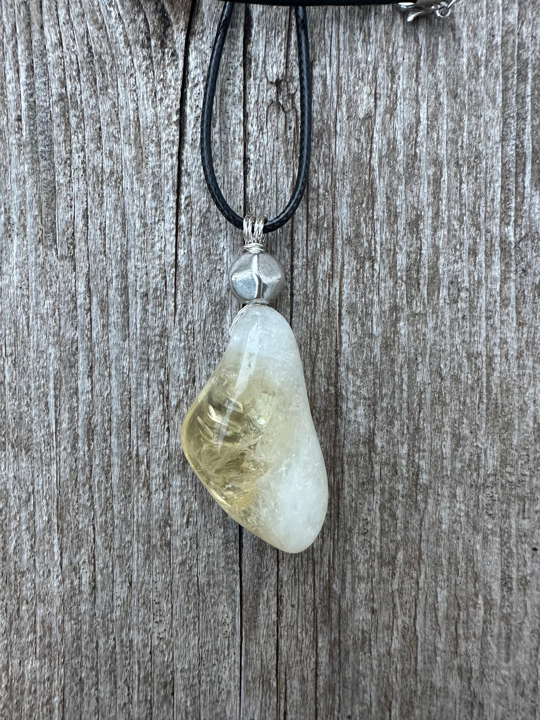 Citrine for Manifestation, Positivity, and Confidence. Swirl to Signify Consciousness.