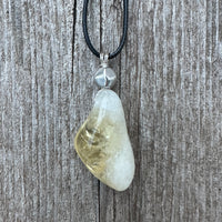 Citrine for Manifestation, Positivity, and Confidence. Swirl to Signify Consciousness.