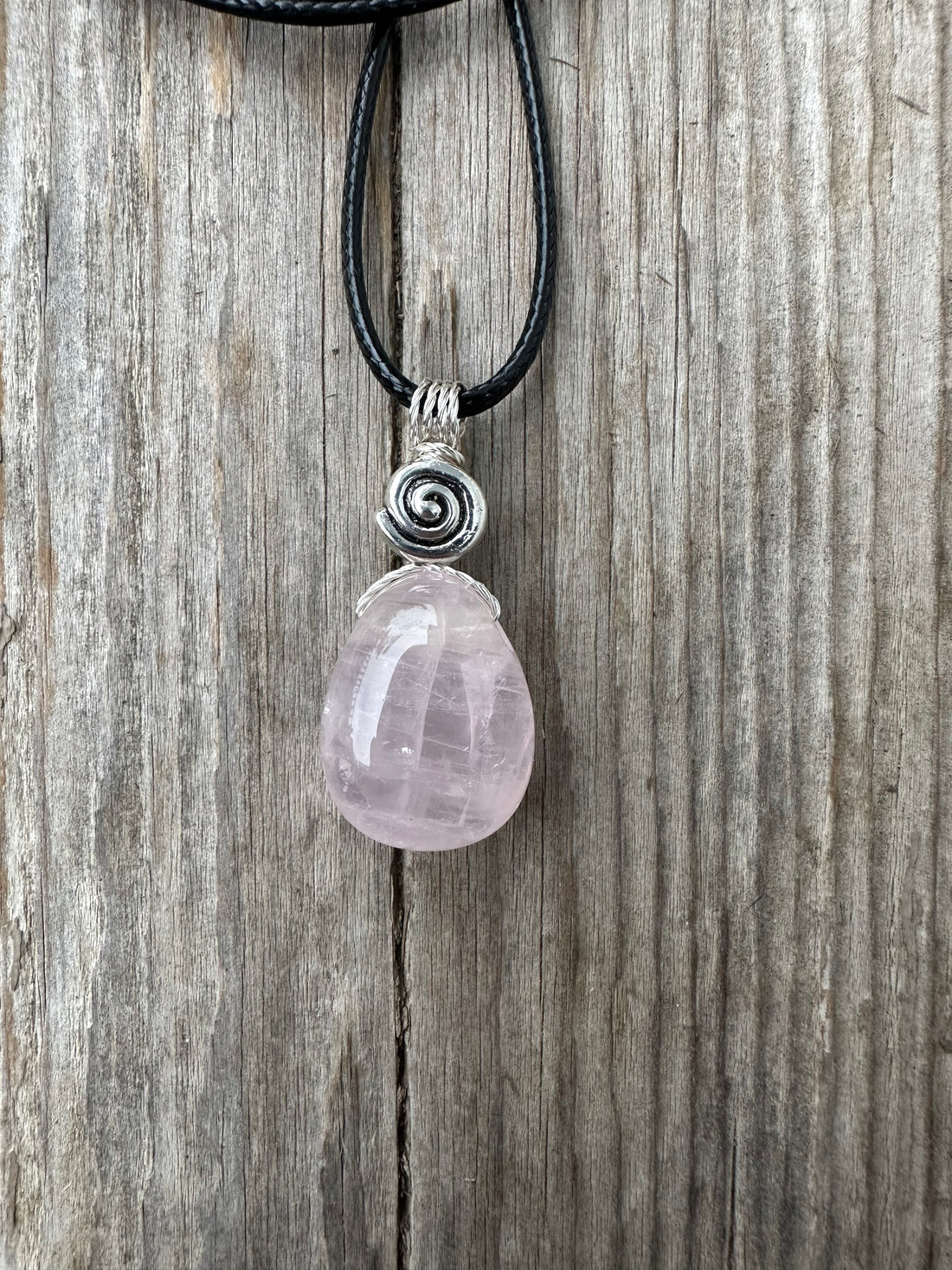 Rose Quartz for Love. Swirl to Signify Consciousness