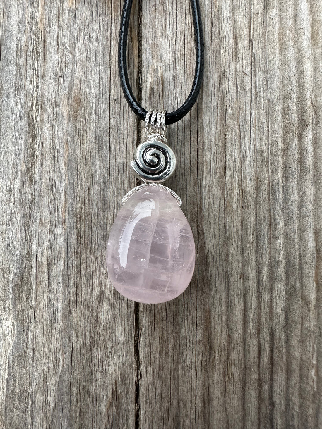 Rose Quartz for Love. Swirl to Signify Consciousness