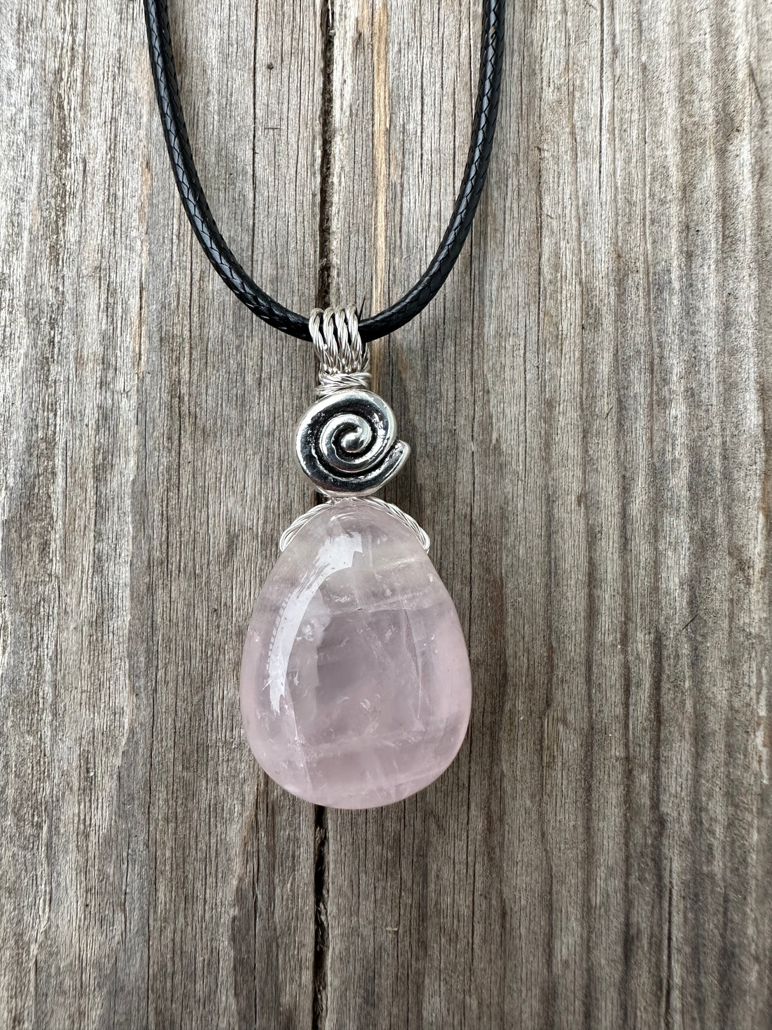 Rose Quartz for Love. Swirl to Signify Consciousness