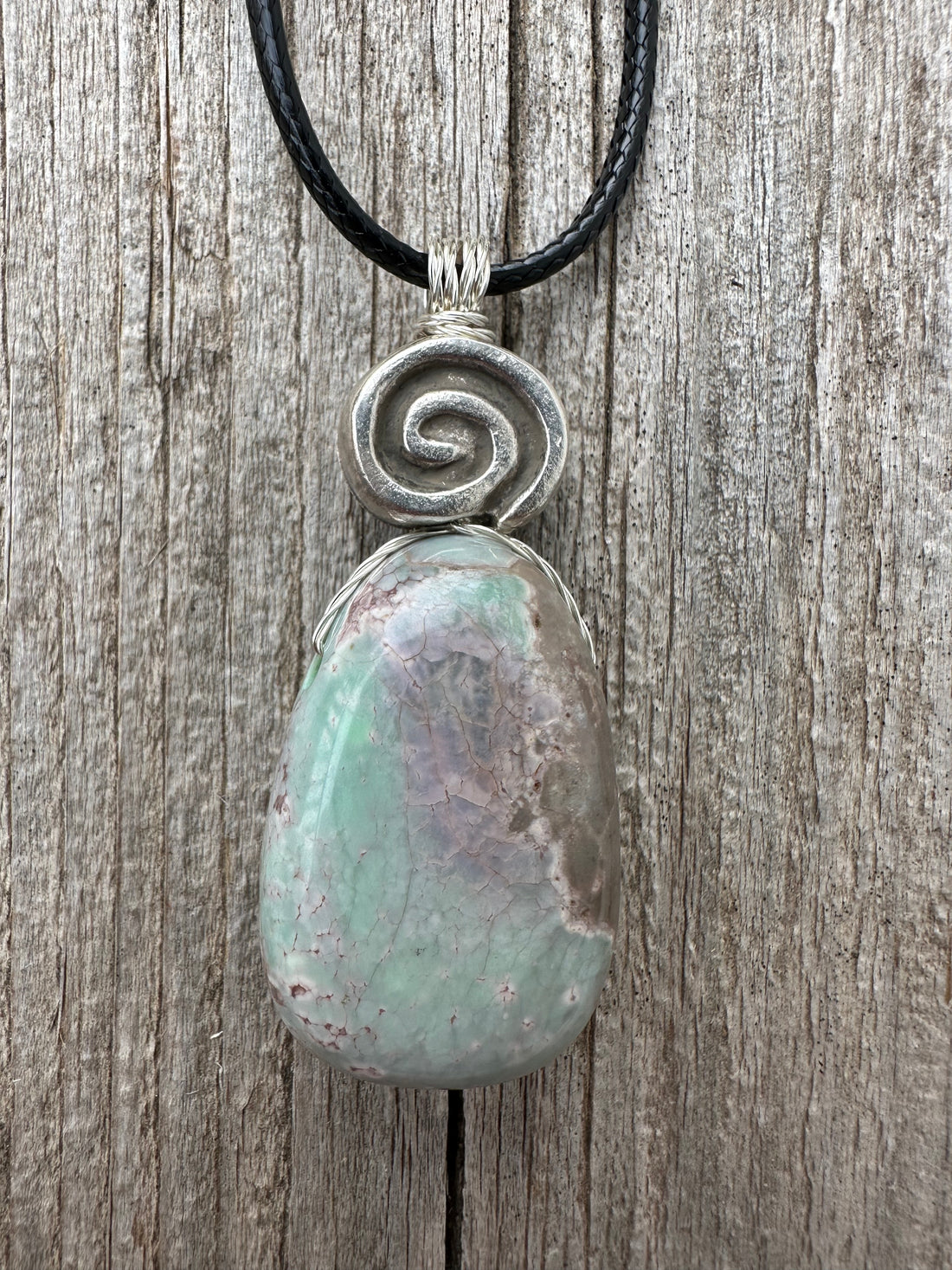 Variscite for Encouragement, Abundance, and Love. Swirl to Signify Consciousness.