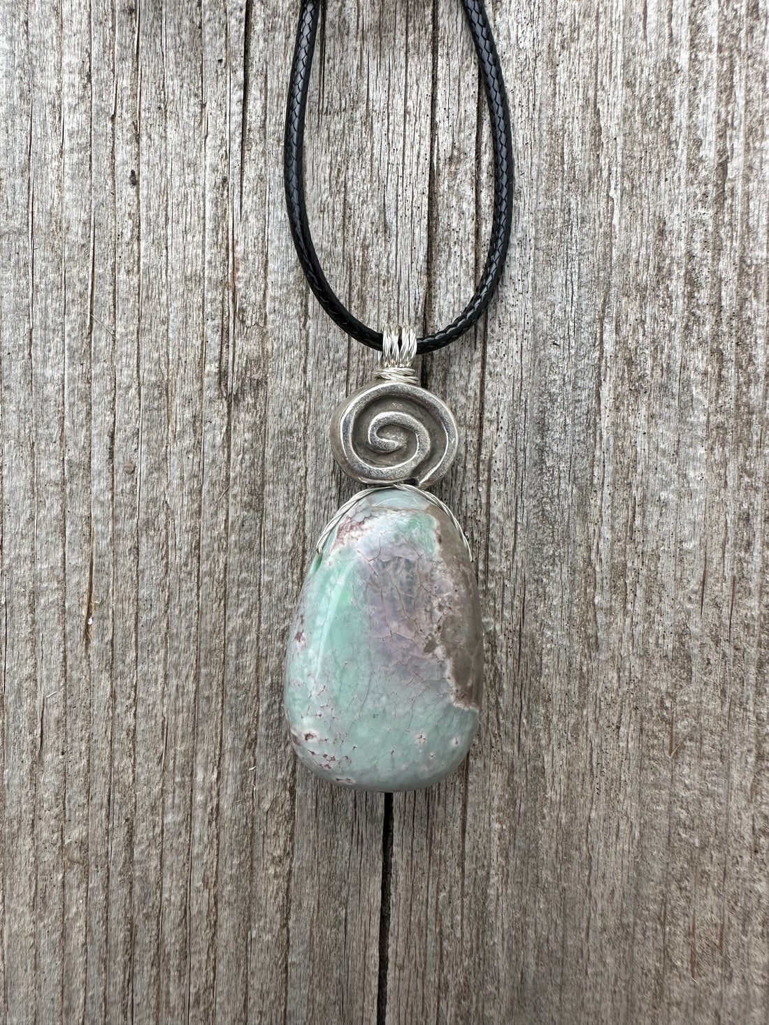 Variscite for Encouragement, Abundance, and Love. Swirl to Signify Consciousness.