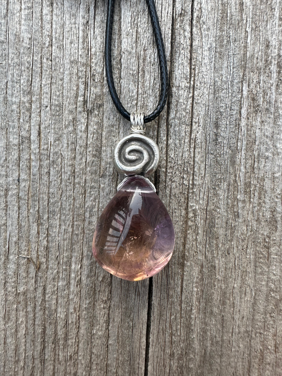 Ametrine for Connecting Physical and Metaphysical Realms, Clarity, and Harmony. Swirl to Signify Consciousness.