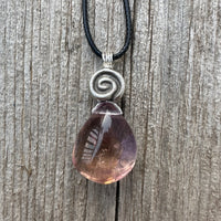 Ametrine for Connecting Physical and Metaphysical Realms, Clarity, and Harmony. Swirl to Signify Consciousness.