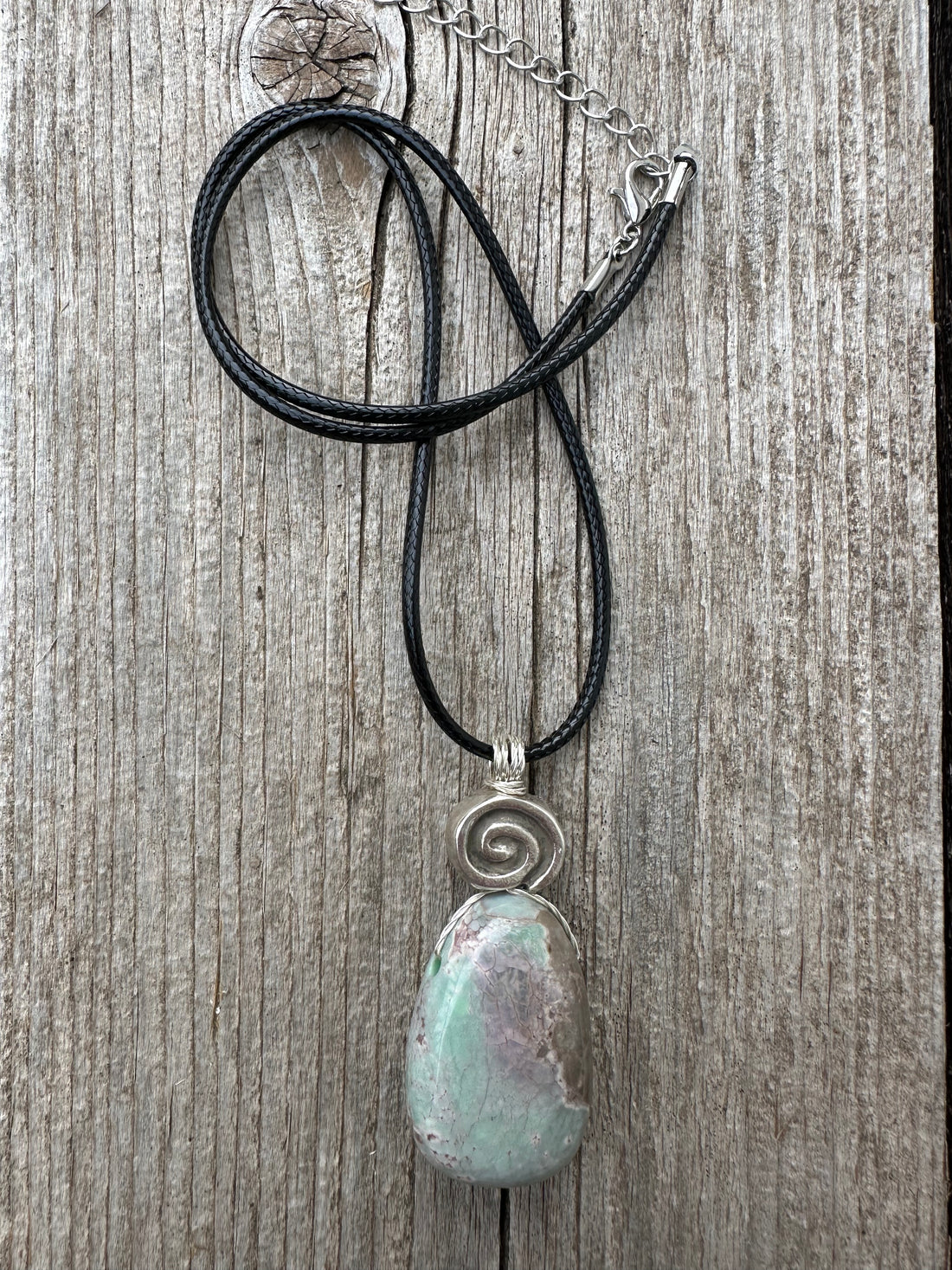 Variscite for Encouragement, Abundance, and Love. Swirl to Signify Consciousness.