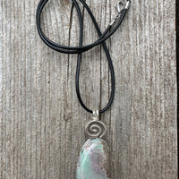 Variscite for Encouragement, Abundance, and Love. Swirl to Signify Consciousness.