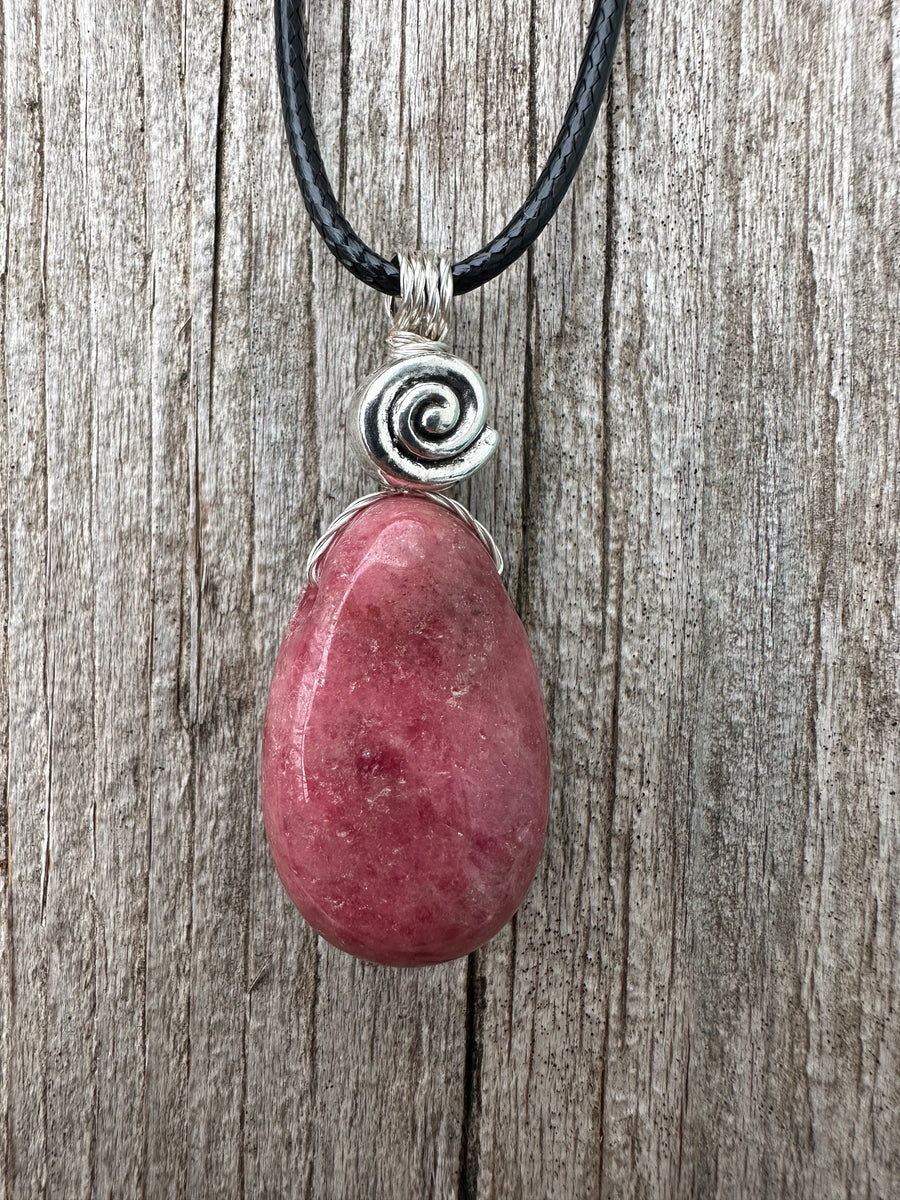 Rhodonite for Compassion, Balancing Emotions, and Self Confidence. Swirl to Signify Consciousness.
