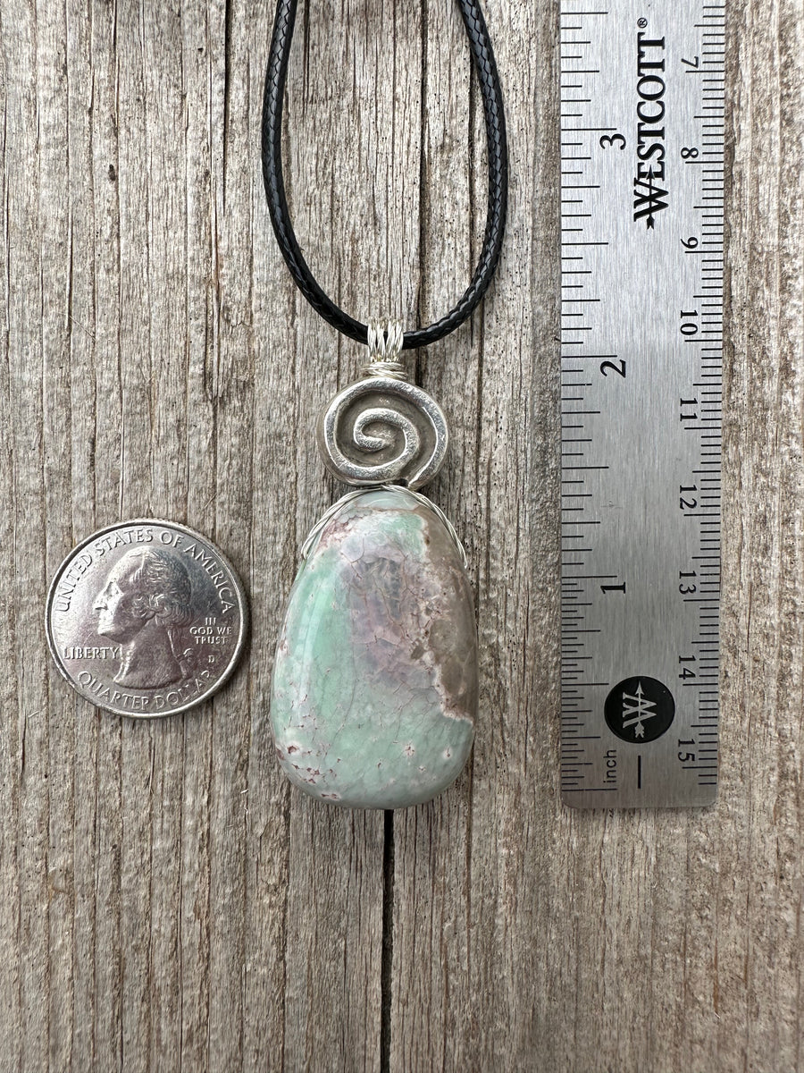 Variscite for Encouragement, Abundance, and Love. Swirl to Signify Consciousness.