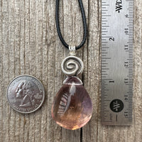 Ametrine for Connecting Physical and Metaphysical Realms, Clarity, and Harmony. Swirl to Signify Consciousness.