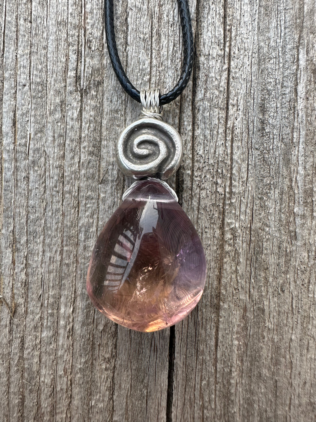 Ametrine for Connecting Physical and Metaphysical Realms, Clarity, and Harmony. Swirl to Signify Consciousness.