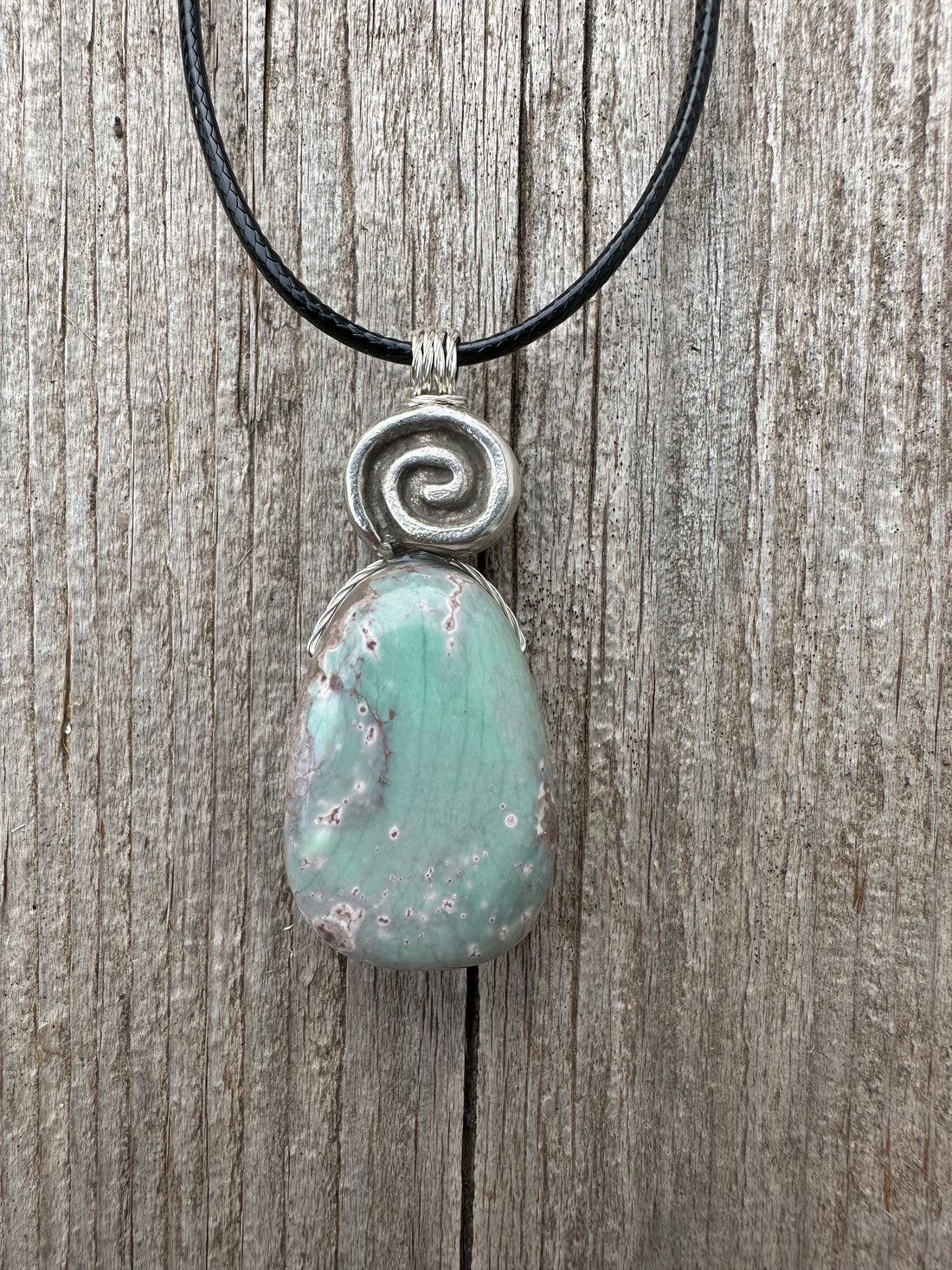 Variscite for Encouragement, Abundance, and Love. Swirl to Signify Consciousness.