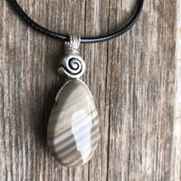 Flint for Grounding and Past Life Work. Swirl to Signify Consciousness.