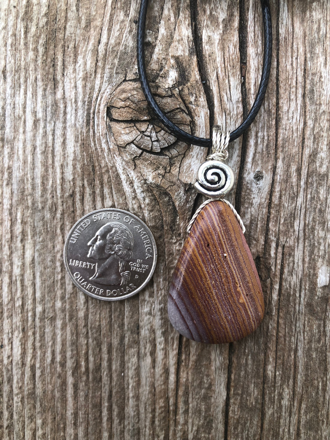 Rhyolite for Igniting Potential, Strength and Creativity. Swirl to Signify Consciousness.