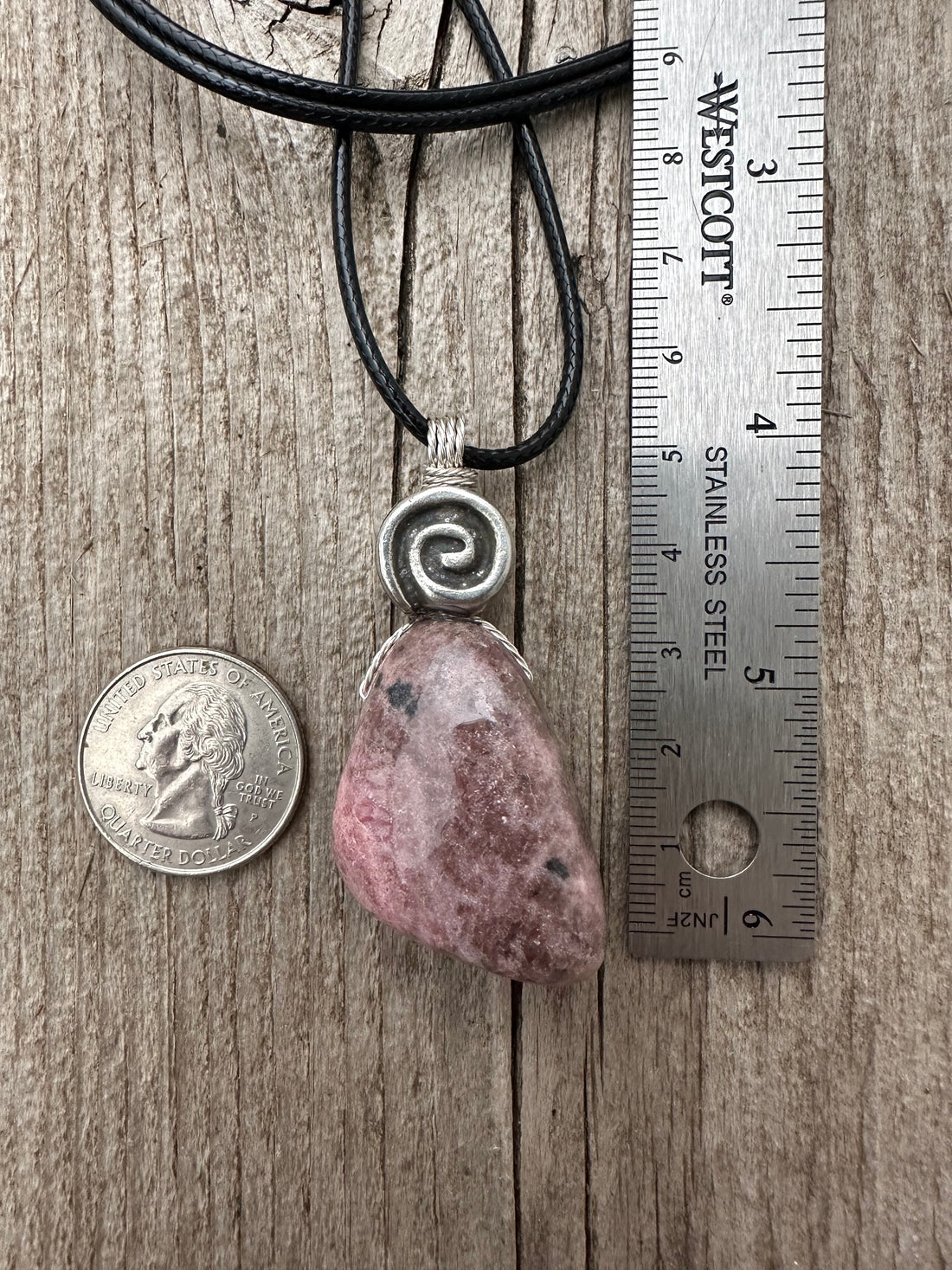 Rhodonite for Compassion, Balancing Emotions, and Self Confidence. Swirl to Signify Consciousness.