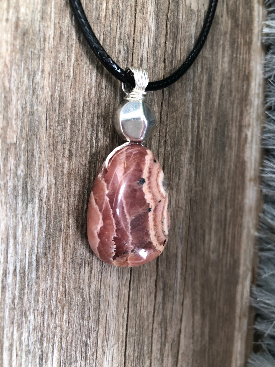 Rhodochrosite for Positivity and Love. Accent Piece is Pewter.