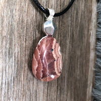 Rhodochrosite for Positivity and Love. Accent Piece is Pewter.