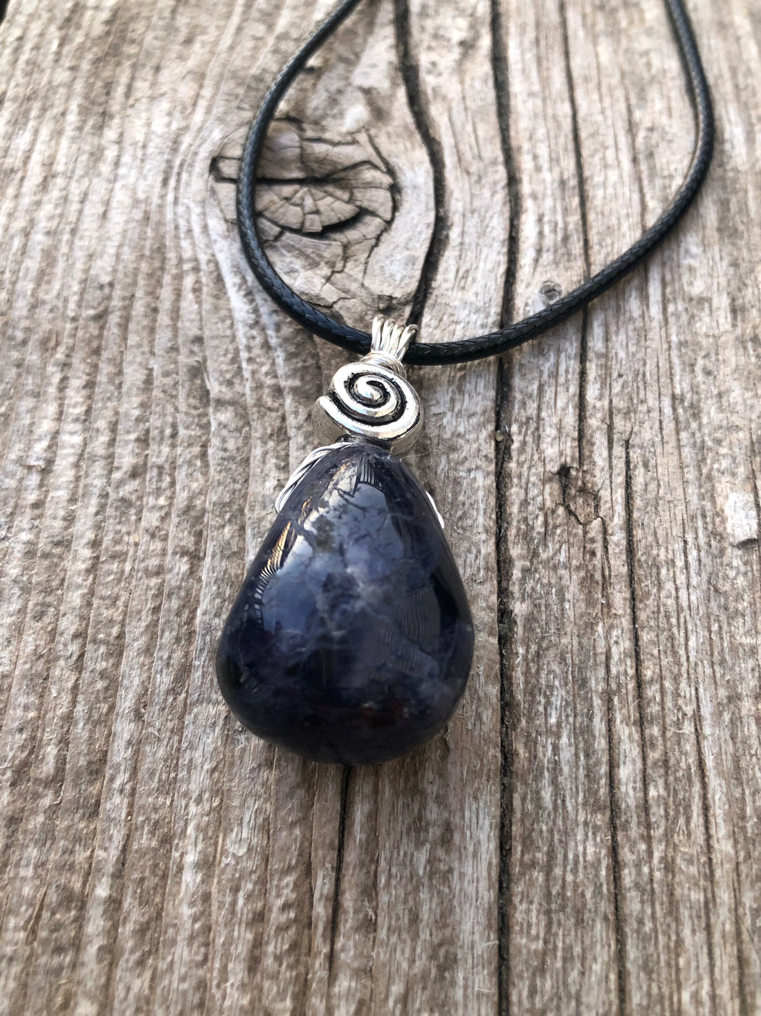 Iolite to Awaken Psychic Abilities. Used in Shamanic Practices. Swirl to Symbolize Consciousness.