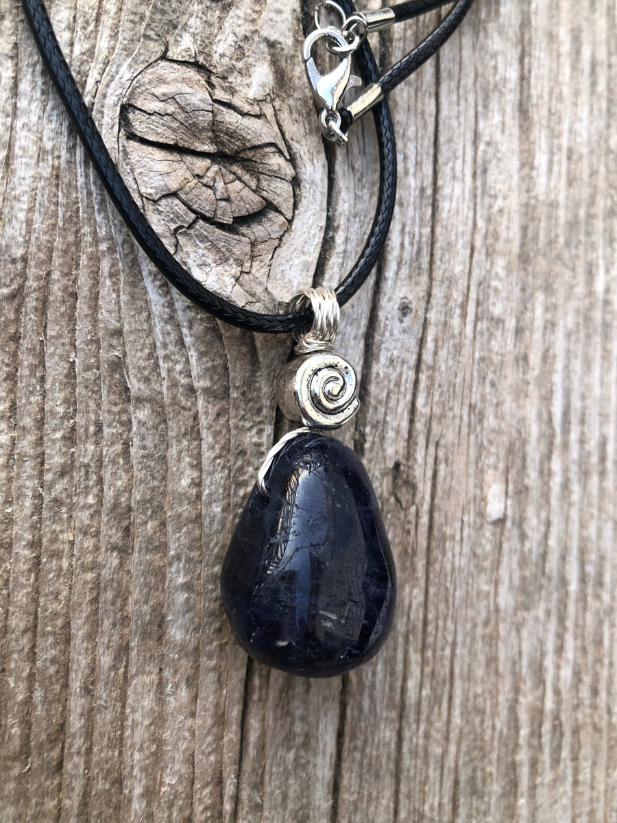 Iolite to Awaken Psychic Abilities. Used in Shamanic Practices. Swirl to Symbolize Consciousness.