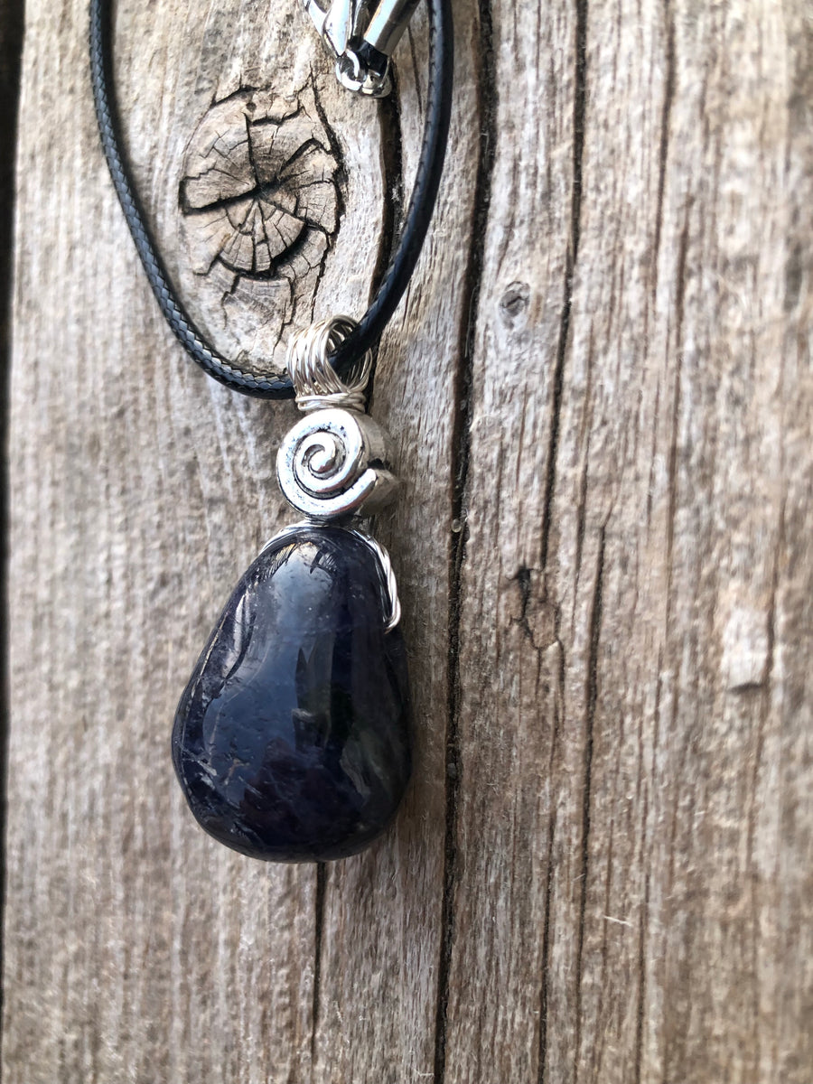 Iolite to Awaken Psychic Abilities. Used in Shamanic Practices. Swirl to Symbolize Consciousness.