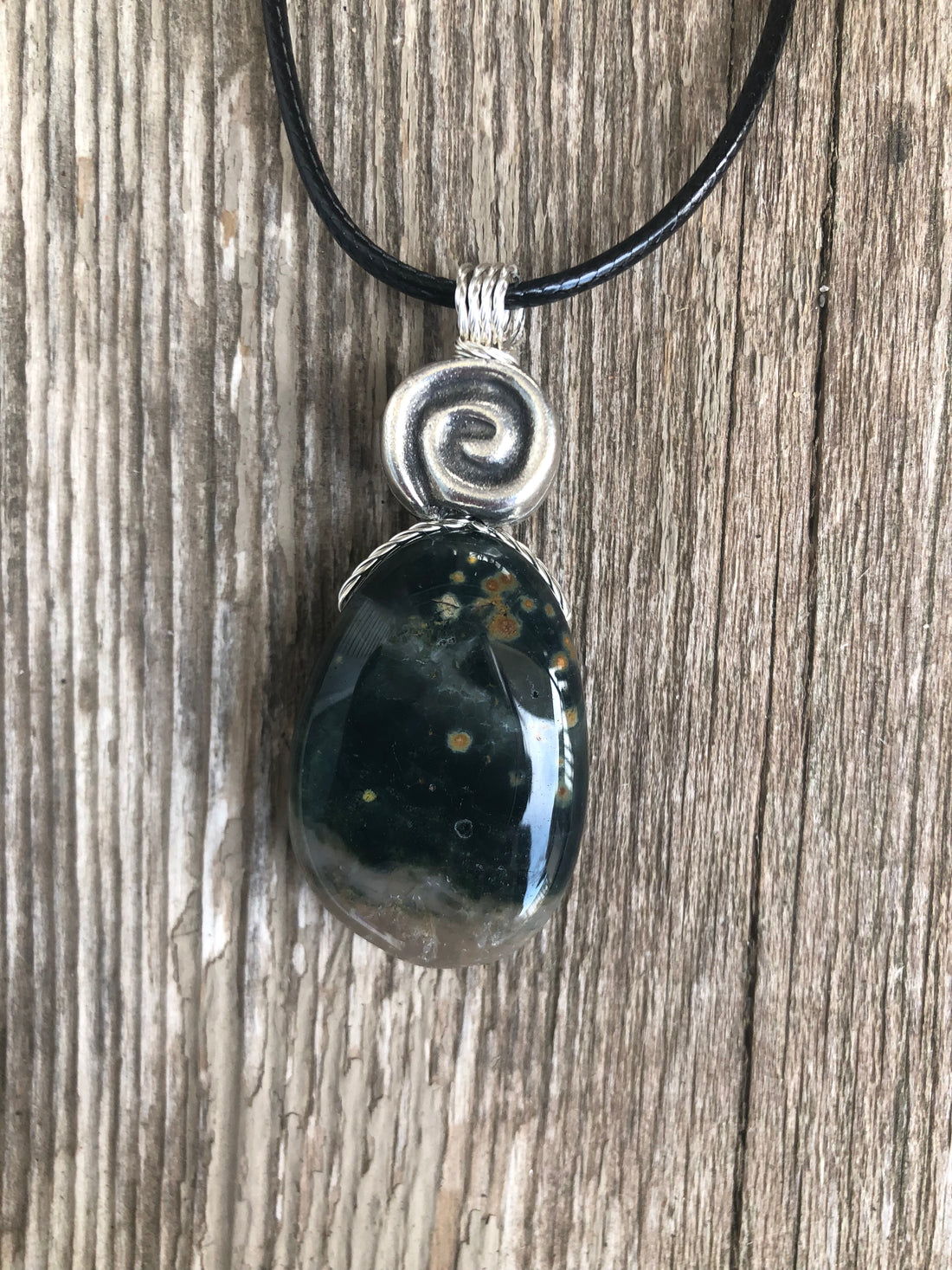 Ocean Jasper for Positivity, Forward Movement. Swirl to Signify Consciousness.