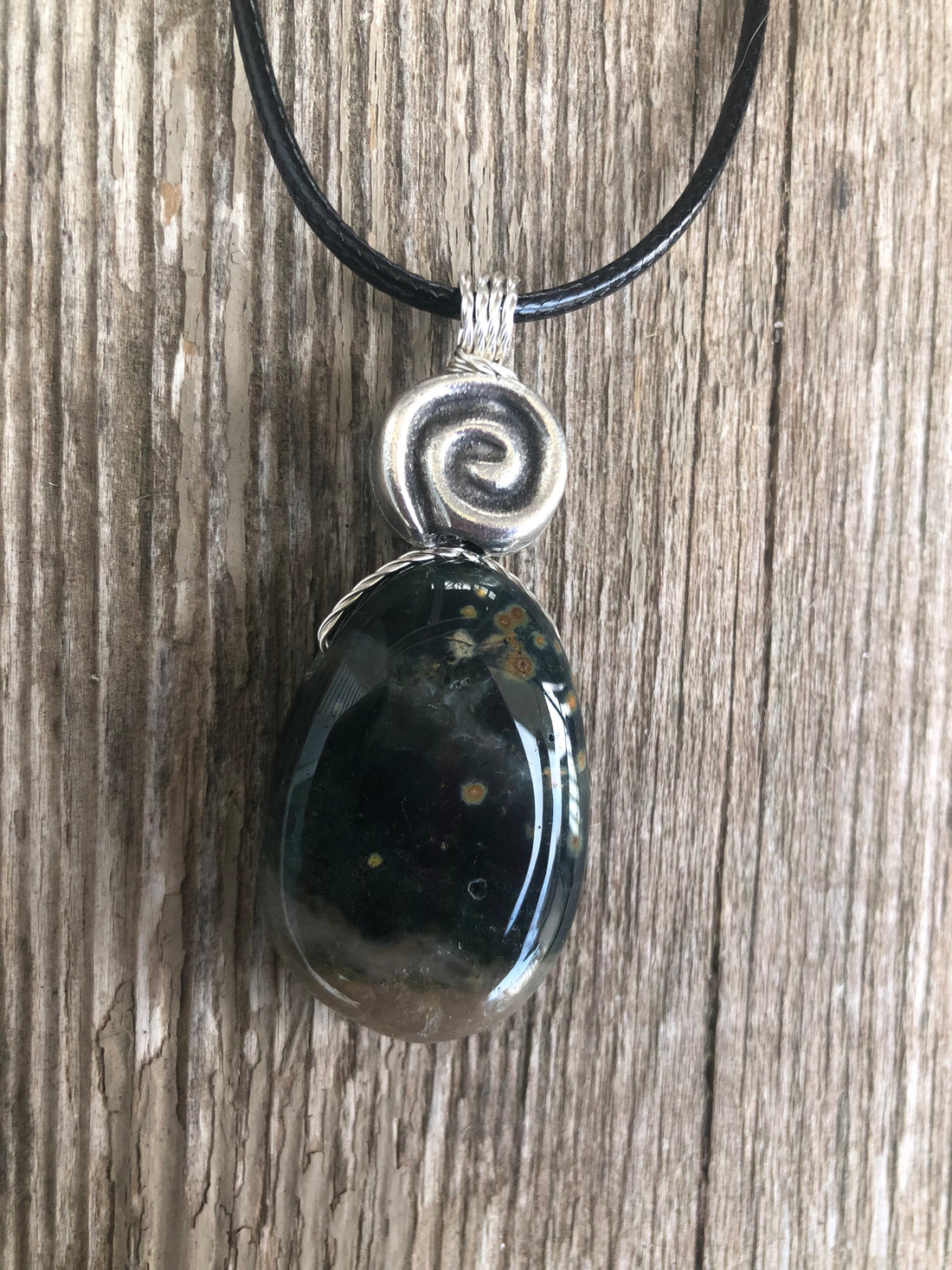 Ocean Jasper for Positivity, Forward Movement. Swirl to Signify Consciousness.